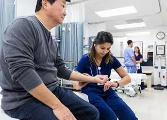 Nursetech Health - Private and Public Hospitals - checking blood pressure