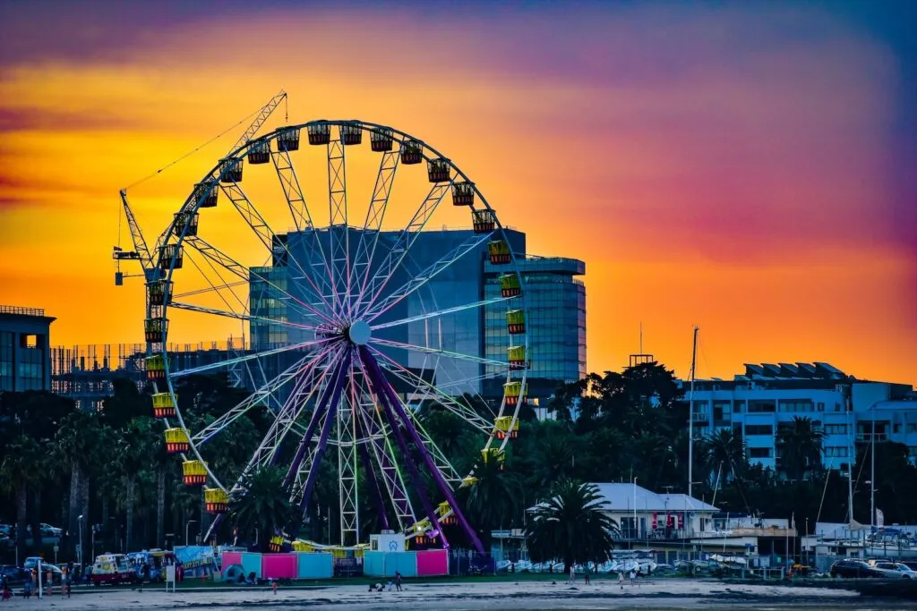 ferris wheel near geelong city buildings during night time